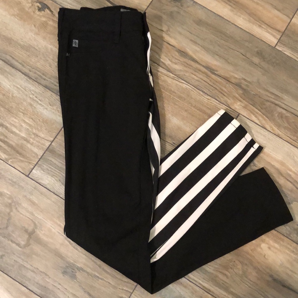 Pants with different color legs.
